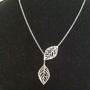 Pretty Silvertoned Crossing Leaves Necklace